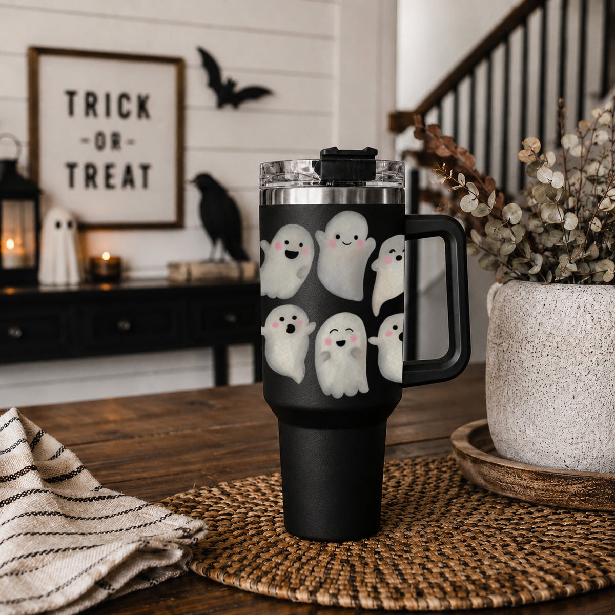 Black 40oz ghost tumbler standing with clear lid and straw, side handle