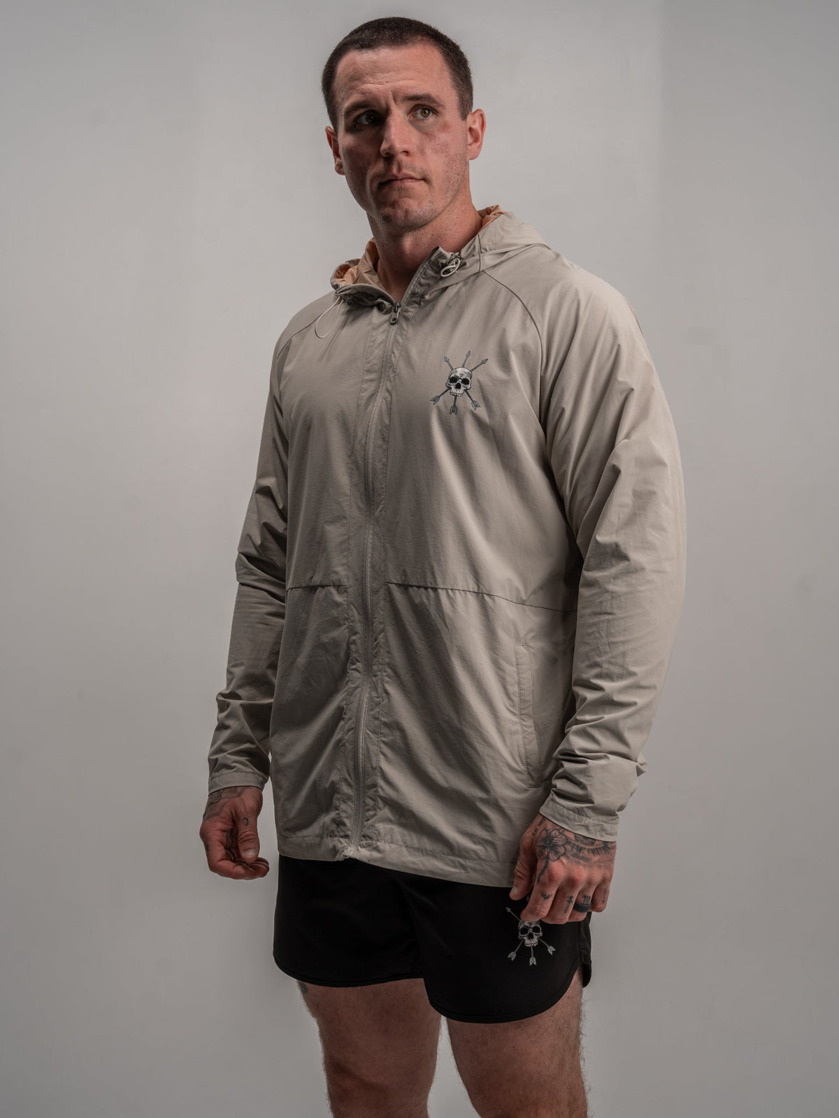 Men's Journey Jacket in light gray with front zipper and hood, chest logo detail
