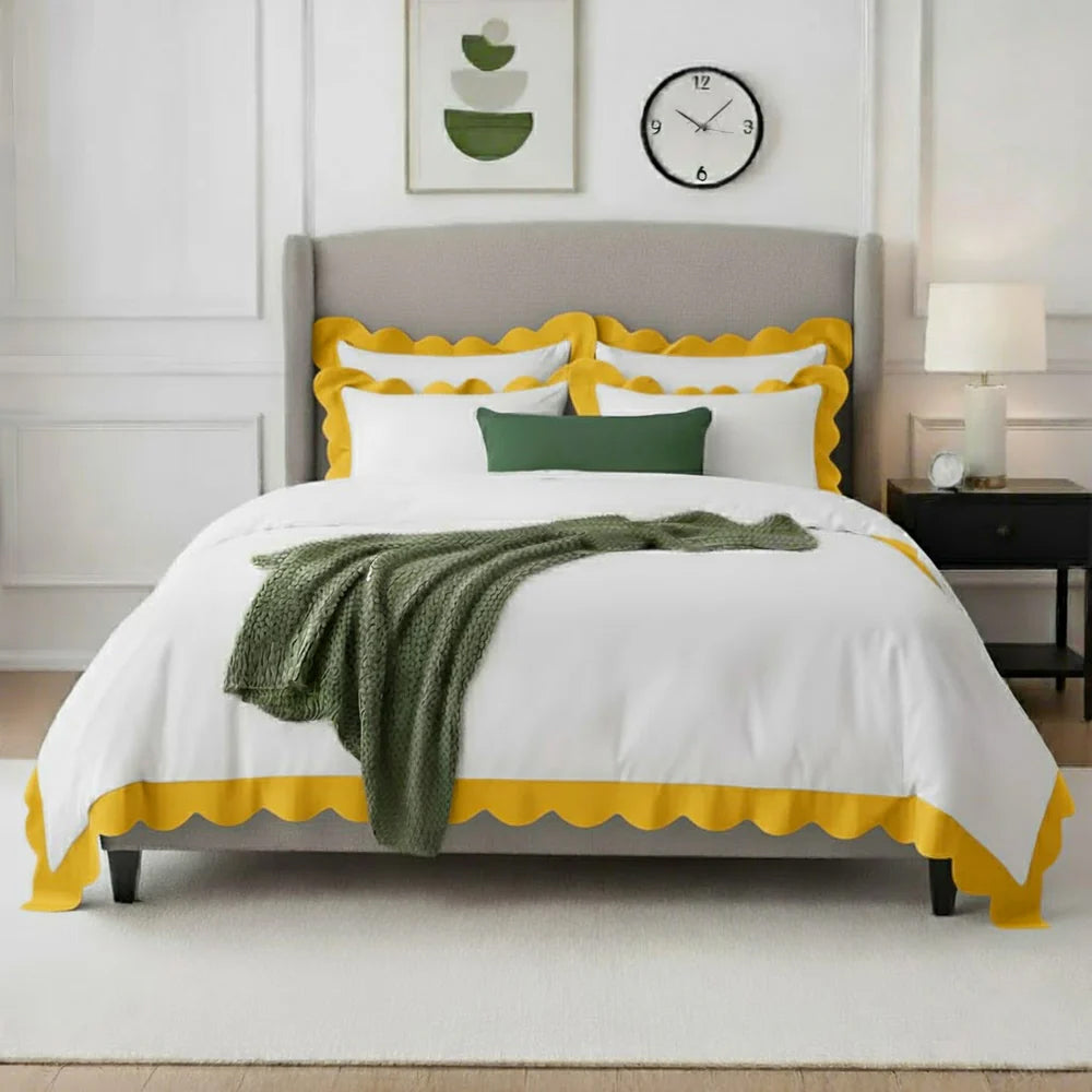 White cotton duvet cover with yellow wavy applique scalloped border and matching shams