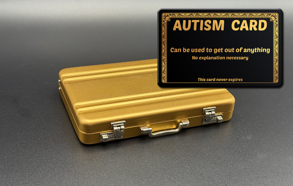 Mini briefcase, gold metal case with Autism card overlay