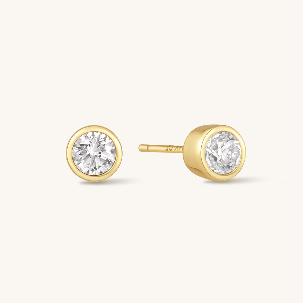 Gold round diamond bezel stud earrings with circular halo and straight posts