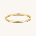 Gold-tone hinged bangle with small round diamond accents, open oval silhouette