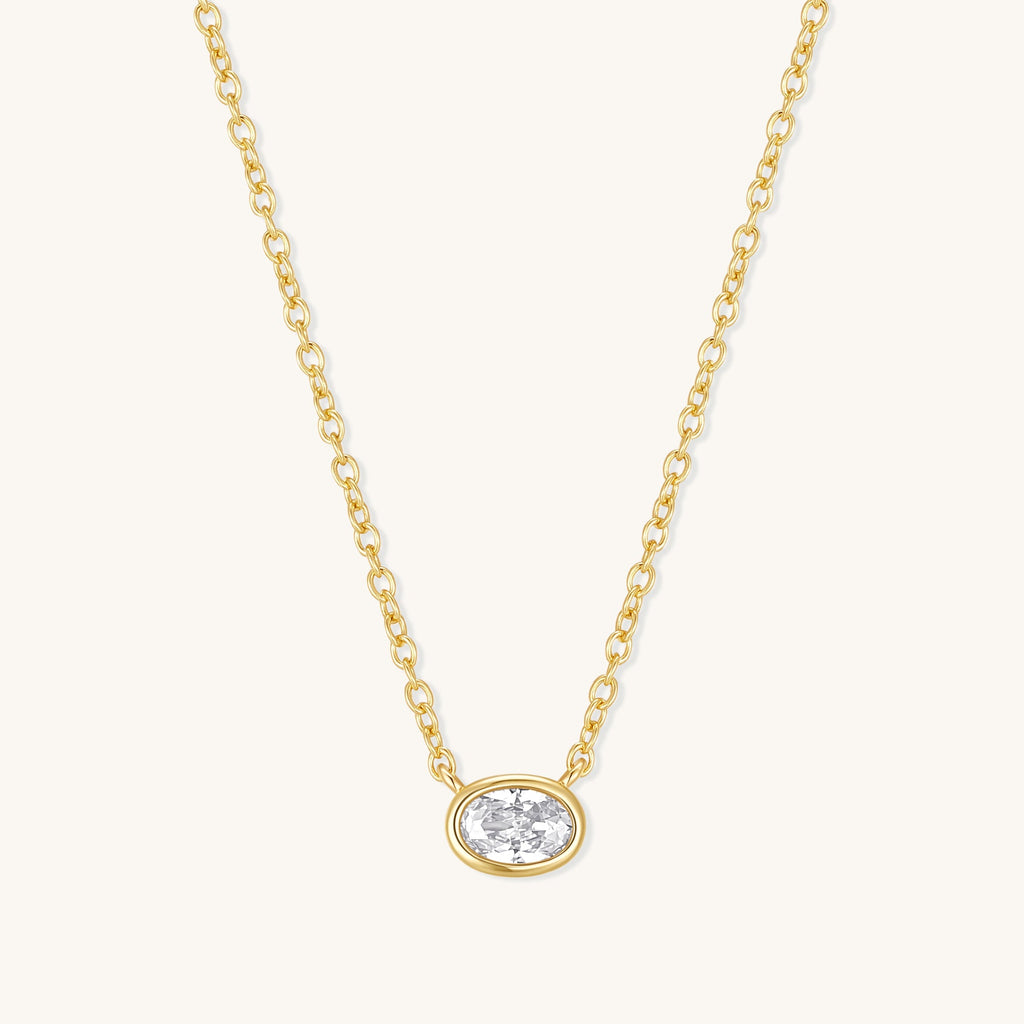 Gold oval diamond pendant necklace on fine chain