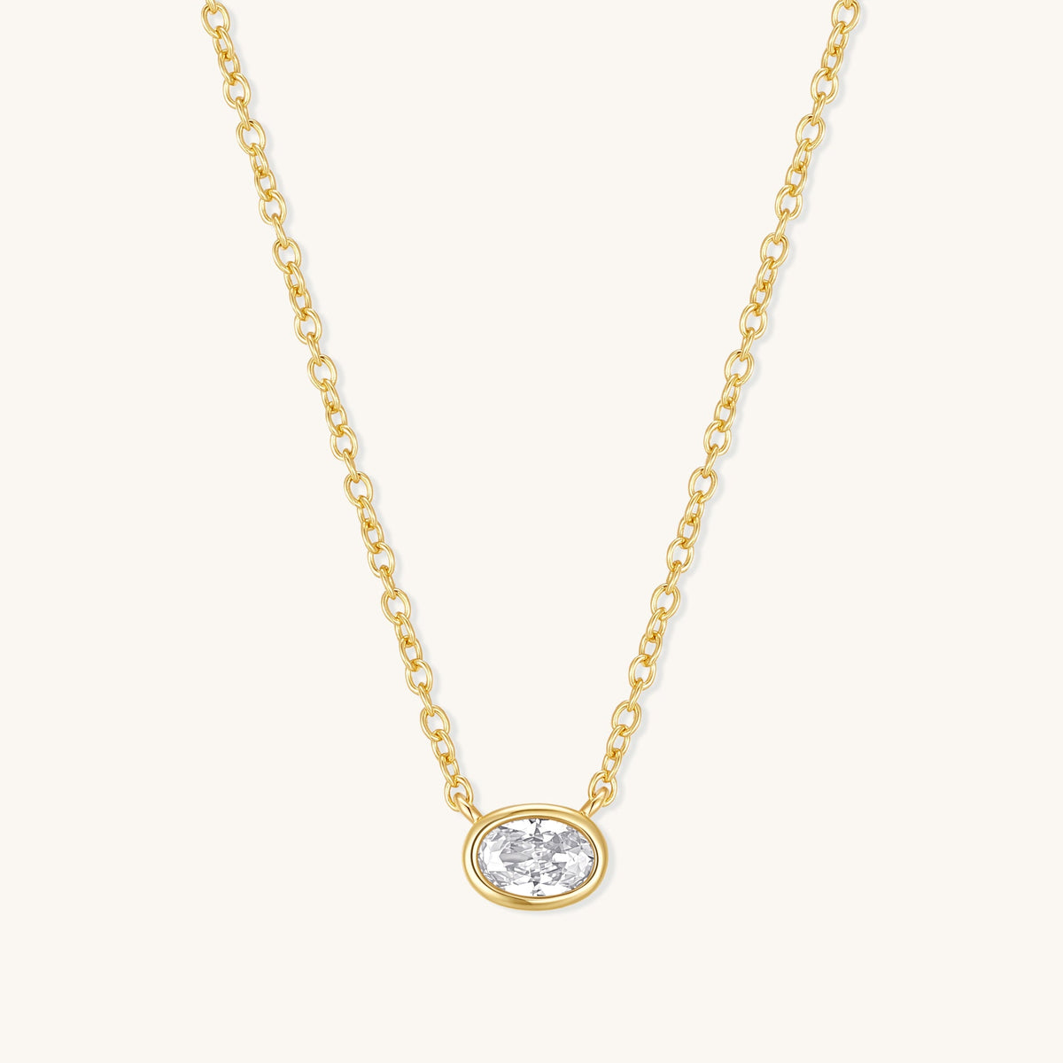 Gold oval diamond pendant necklace on fine chain