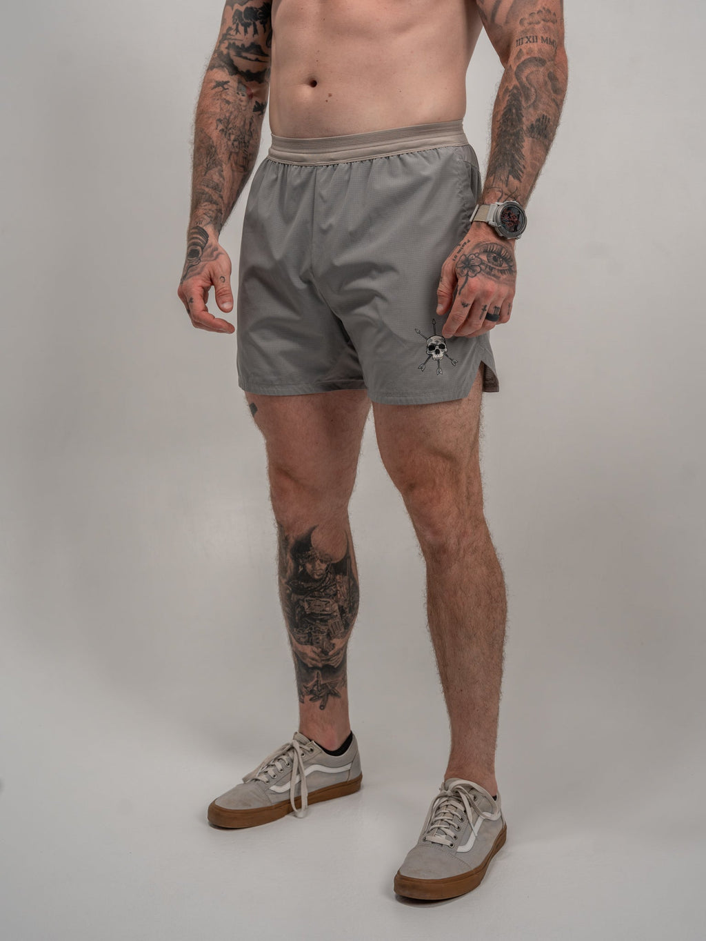 Men's Hybriflex shorts, gray athletic fit with elastic waistband; skull graphic on side.