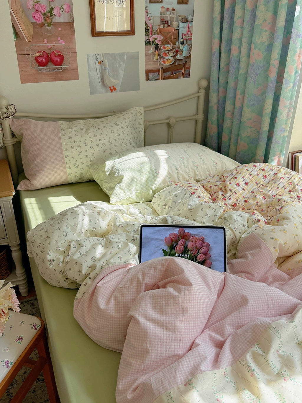 Duvet cover set with spring-green floral print, pale pink check, and pillowcases