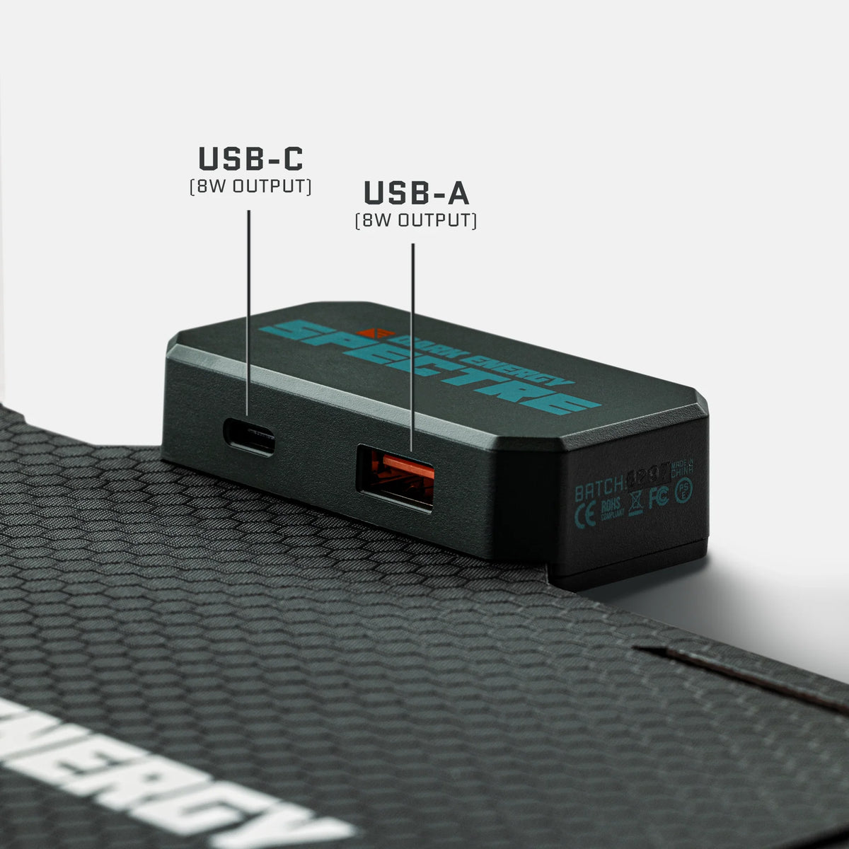 8W solar panel close-up with USB-A and USB-C ports on dark case