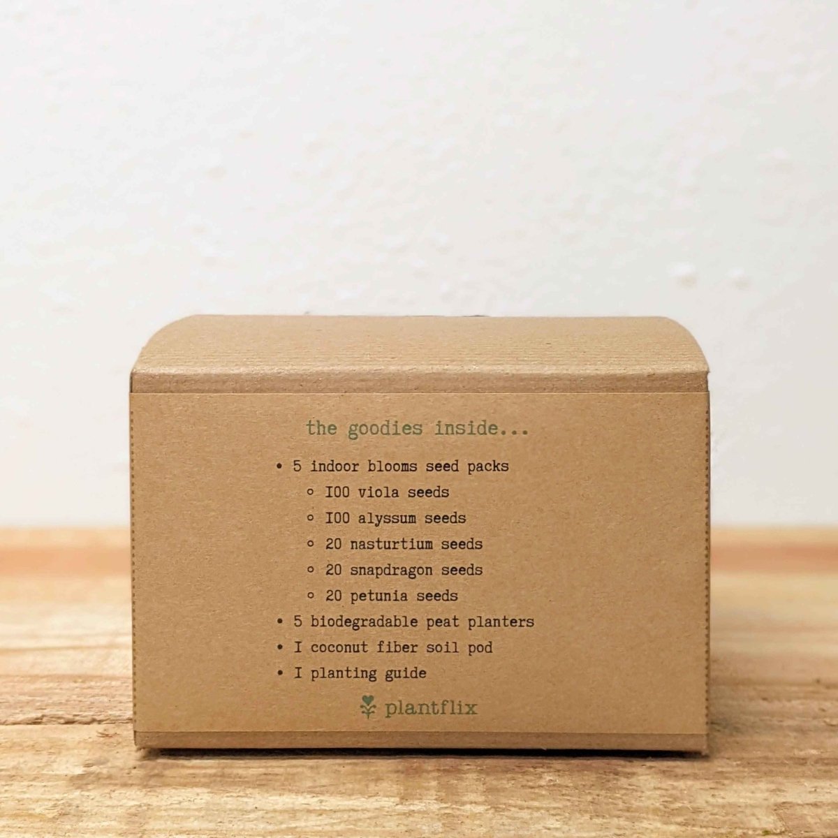 Kraft seed kit box back panel listing contents and planting guide