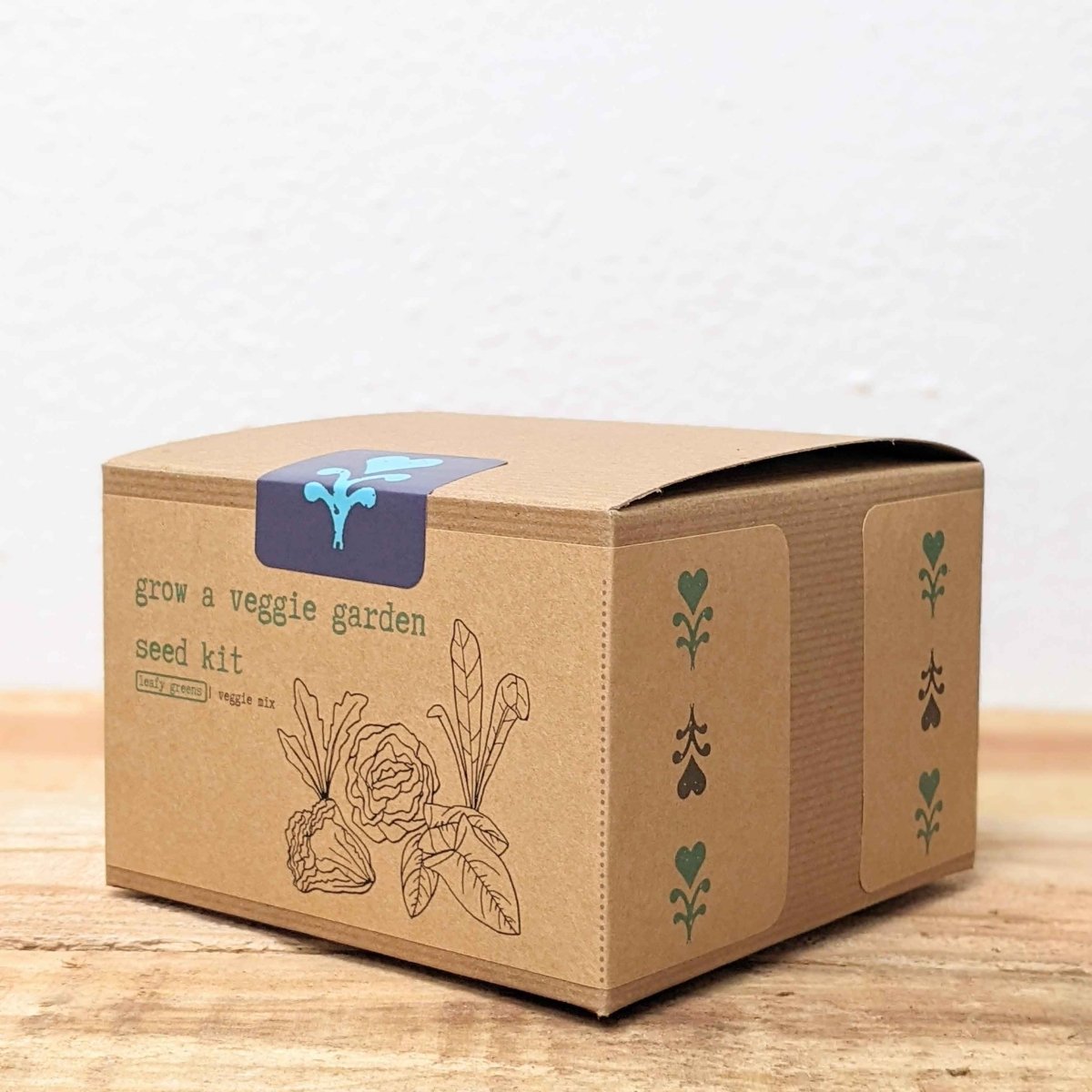 Leafy greens seed kit cardboard box with blue logo and plant line art