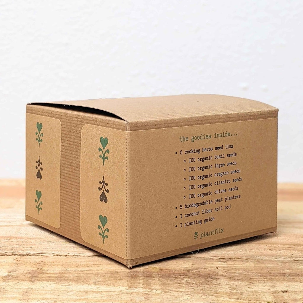 Herb seed kit cardboard box with green icons and printed seed list panel