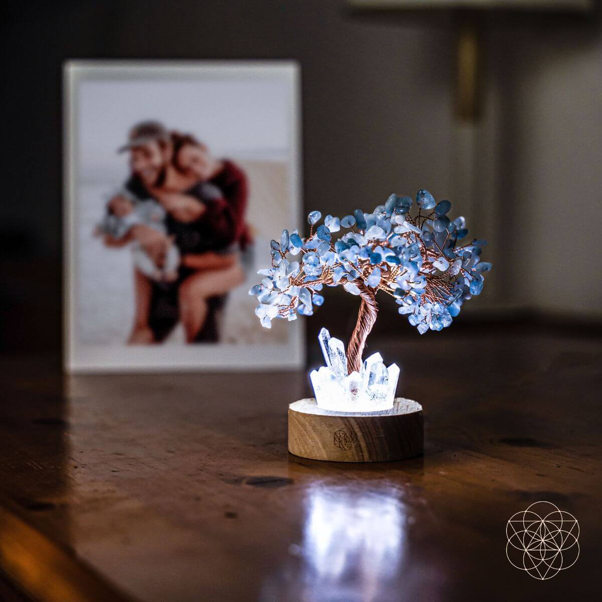 Aquamarine crystal tree lamp on round wood stand with white crystal cluster top