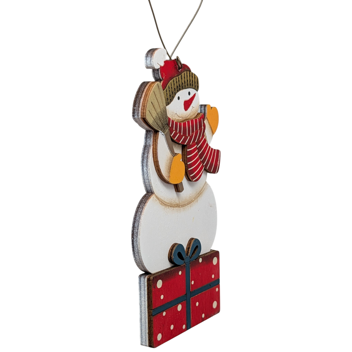 Hand-painted plywood snowman ornament, side view, striped scarf and red gift box