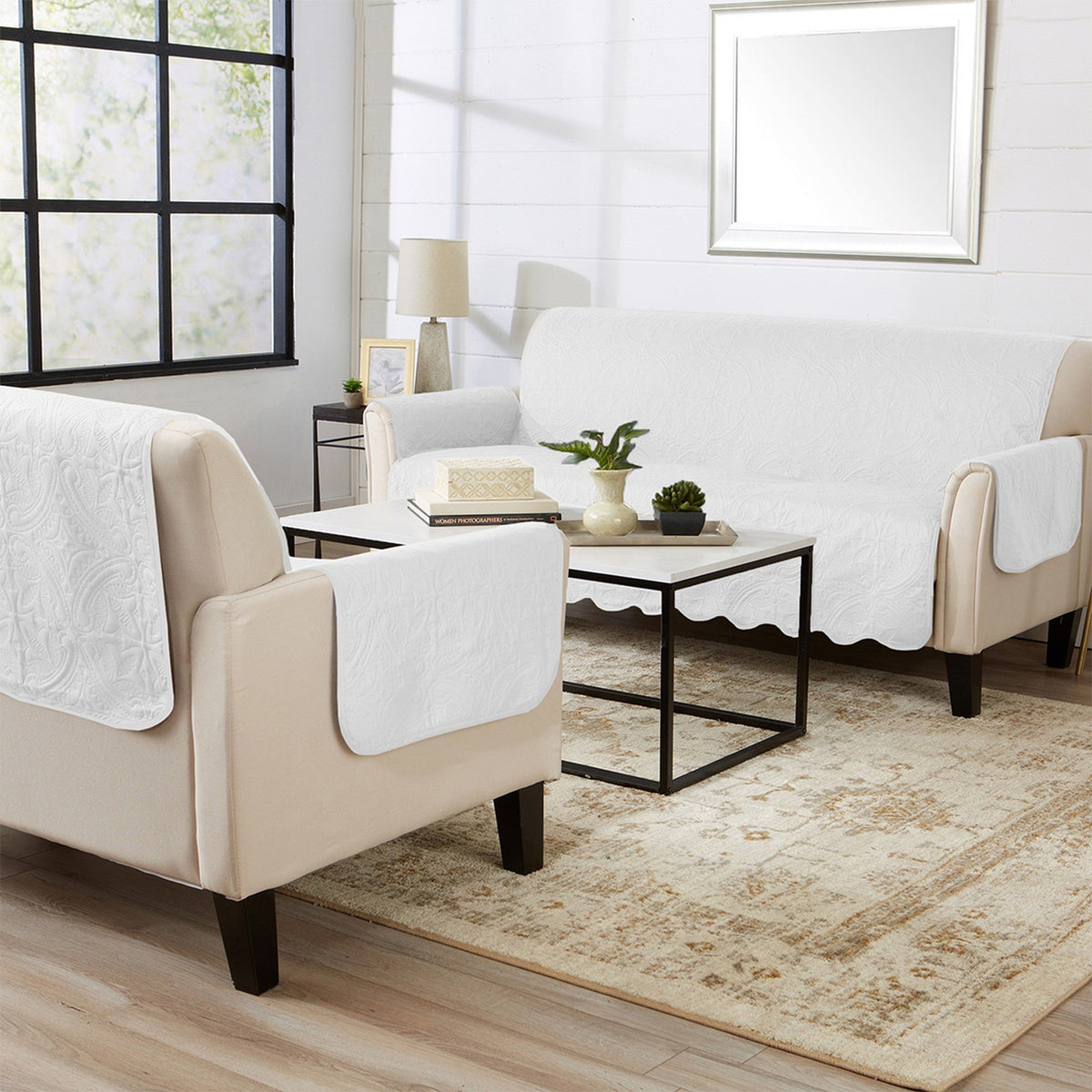 White loveseat and chair protectors with rounded arm openings and scalloped hems