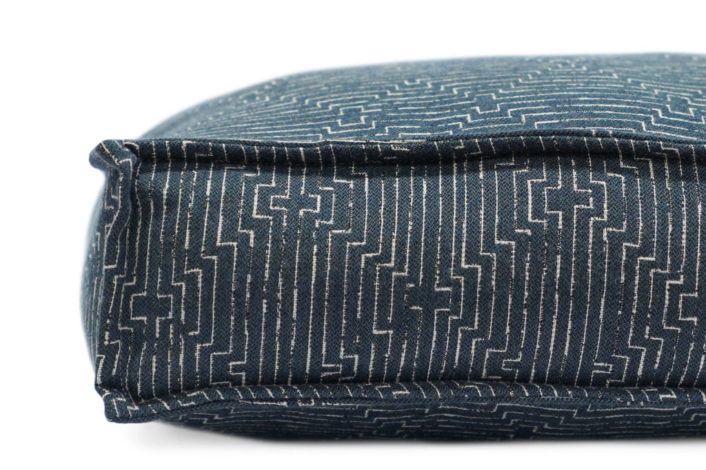 Geometric-pattern pet lounger bed with rolled edge bolster in dark denim