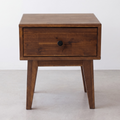 Chocolate wood nightstand with one drawer and round black knob, tapered legs