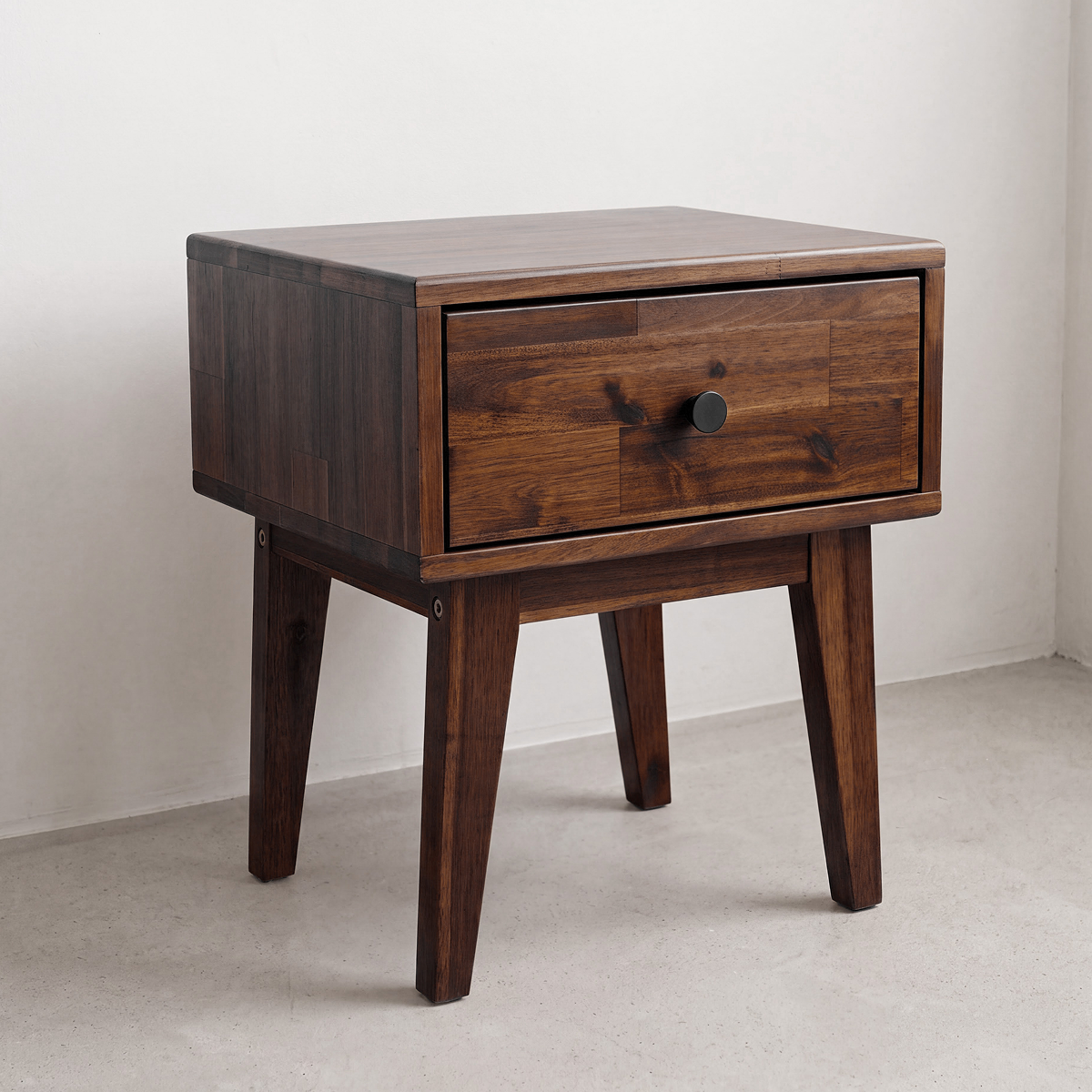 Dark wood nightstand with one drawer and round knob, square frame and legs