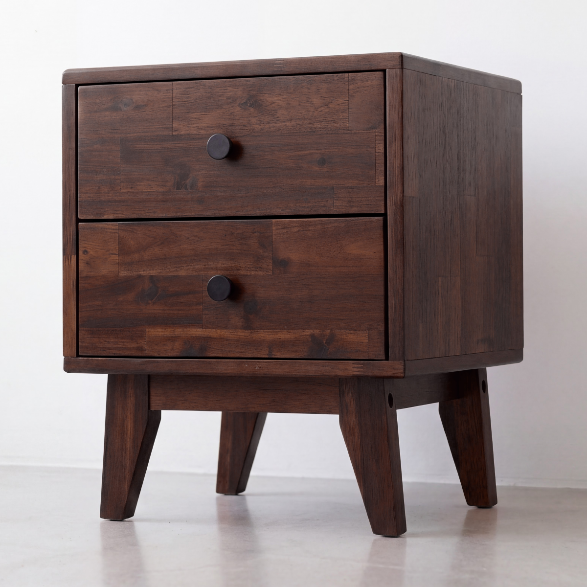 Walnut-toned solid wood nightstand with two drawers and round knobs on front
