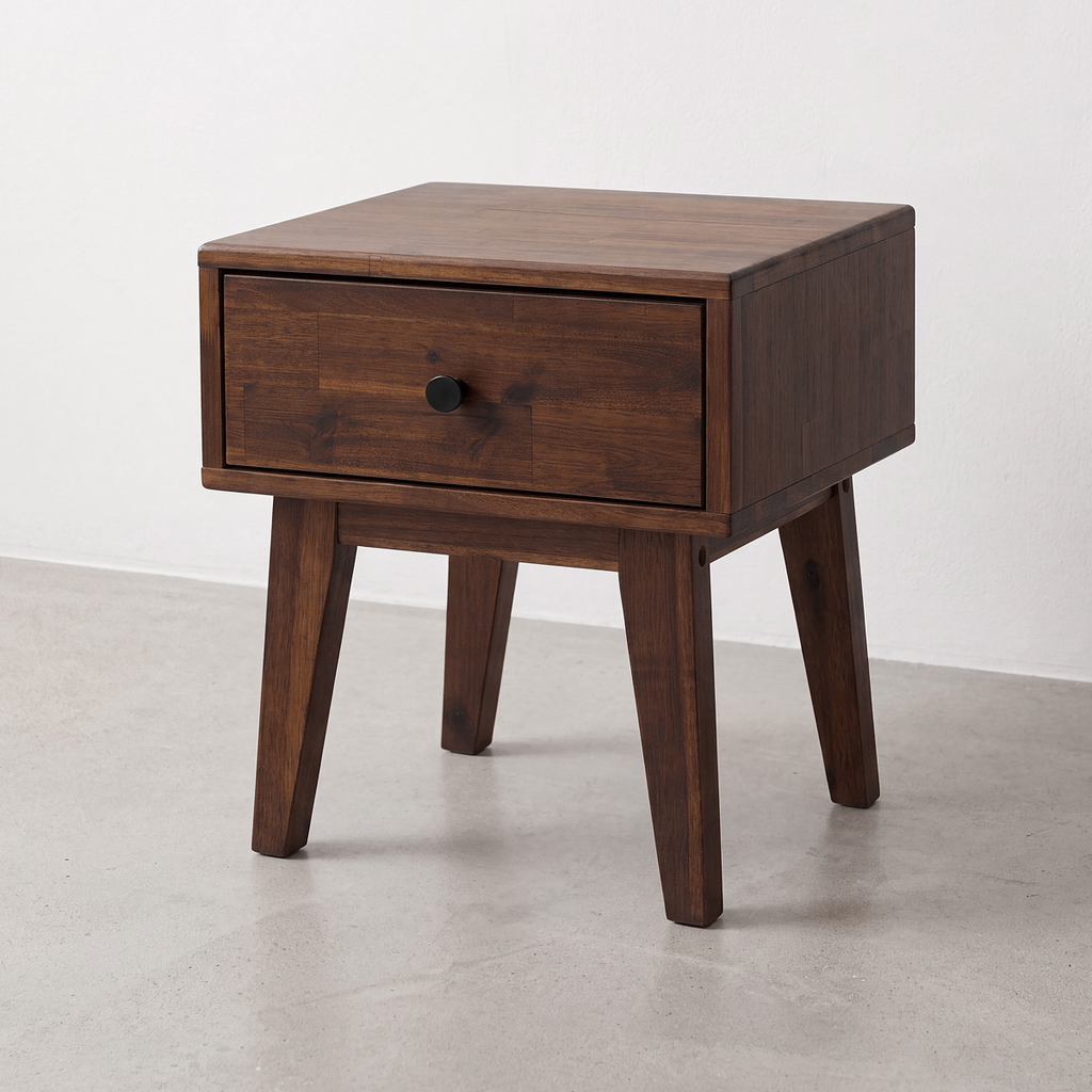 Caramel wood nightstand with one drawer and round black knob, tapered legs