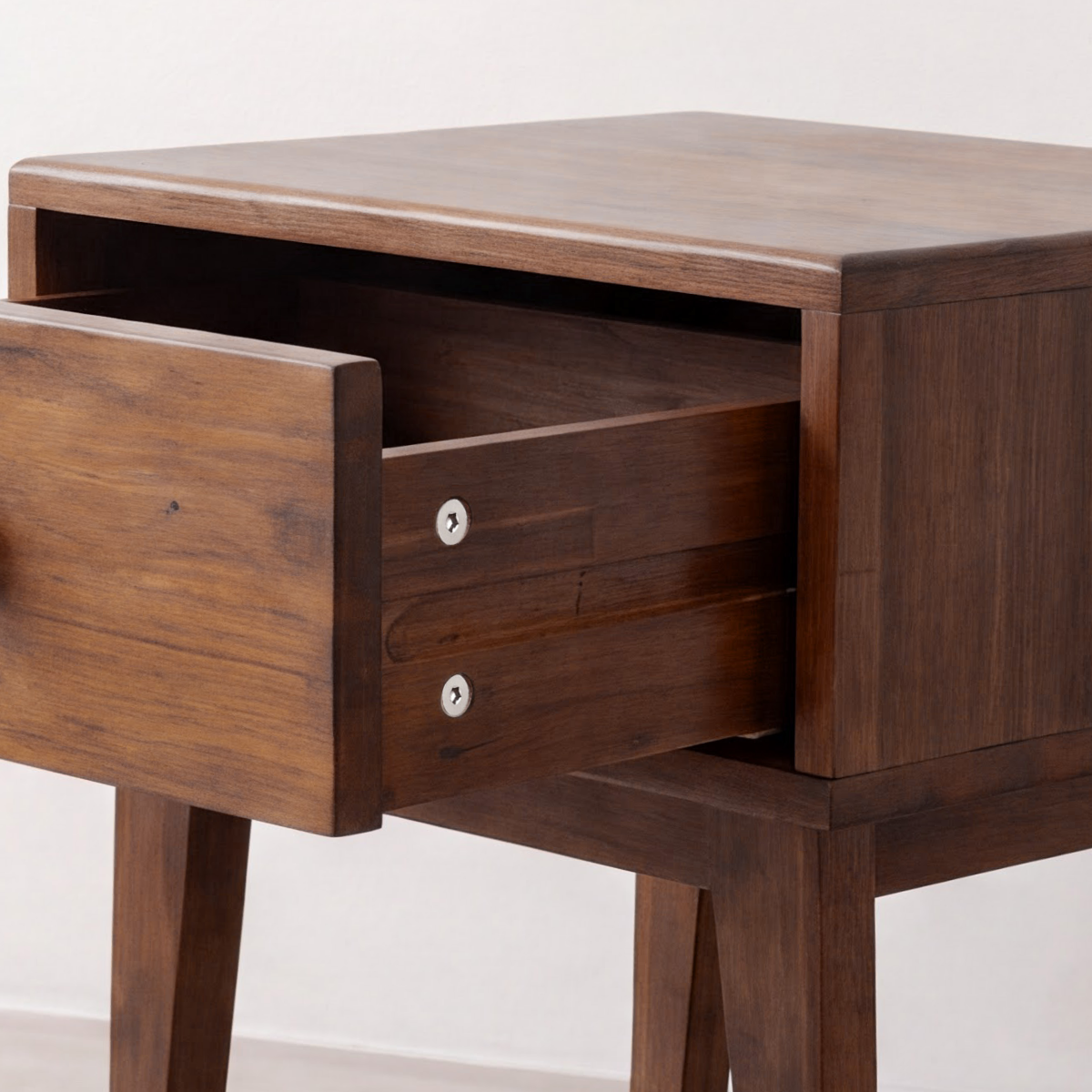Wood nightstand drawer interior and pull hardware, front view with open storage