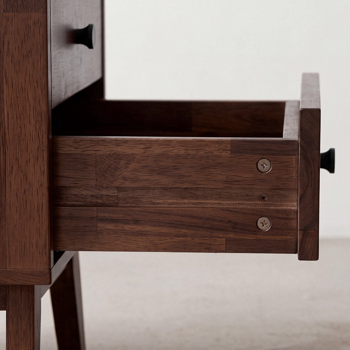 Solid wood nightstand drawer interior with two sliding drawers and metal pulls