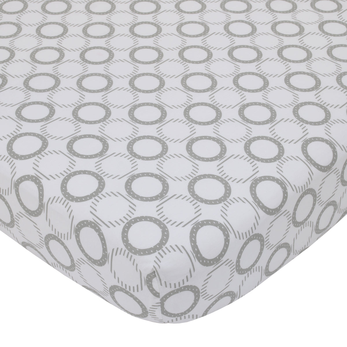 White crib sheet fabric with repeating grey oval-dot ring pattern