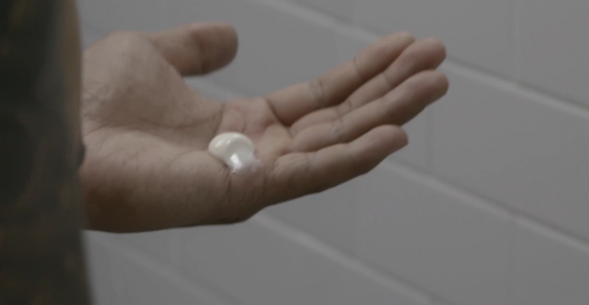 Hair styling paste blob on open palm