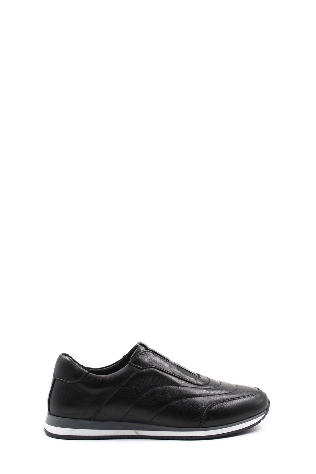 Black leather low-top sneakers with contrast white sole, side profile.