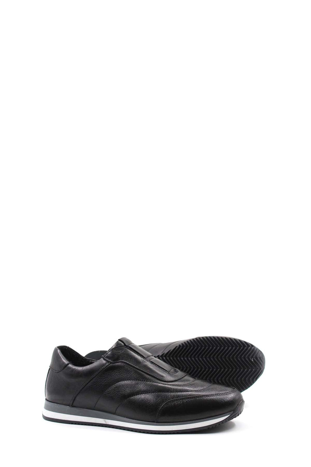 Black leather low-top sneakers with contrast sole, outsole and heel side view.