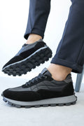Men's black leather lug-sole sneakers by Wessi, lace-up with textured rubber outsole