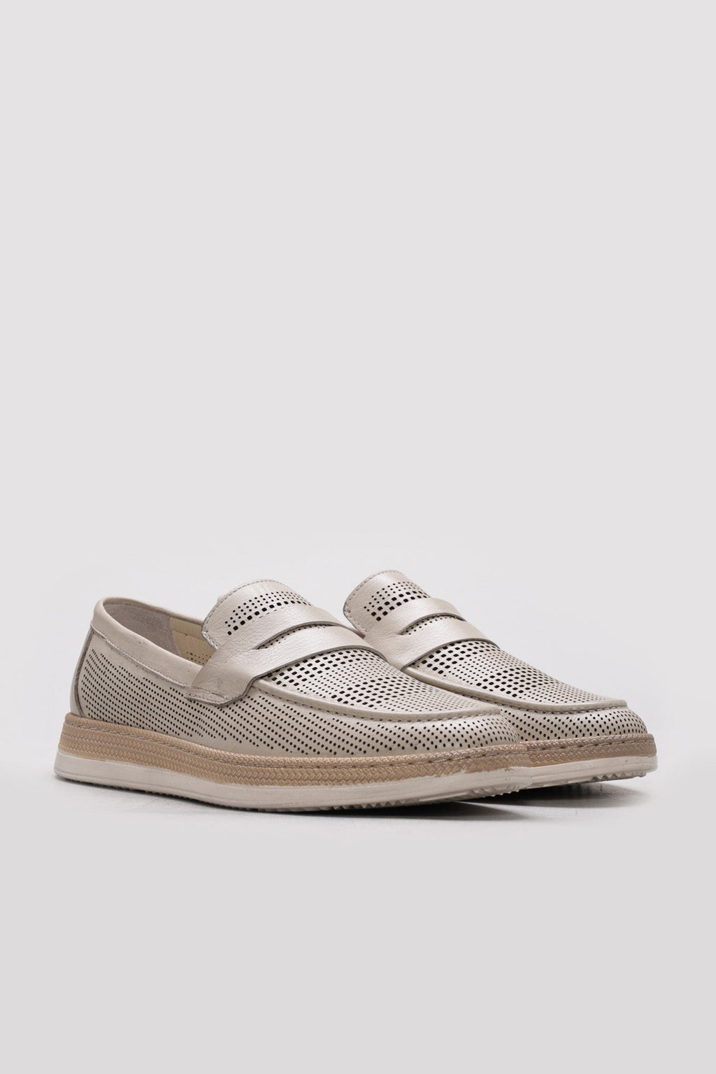 Beige perforated leather loafer with twin strap design and low-profile sole