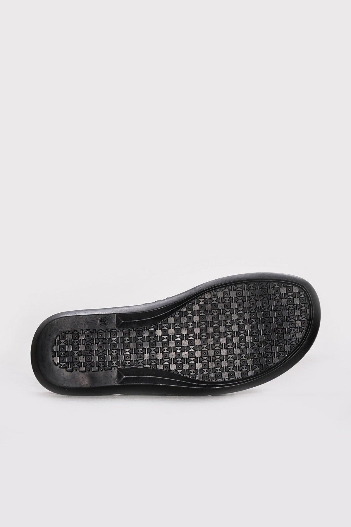 Black rubber outsole with textured pattern for brown leather double-band slides