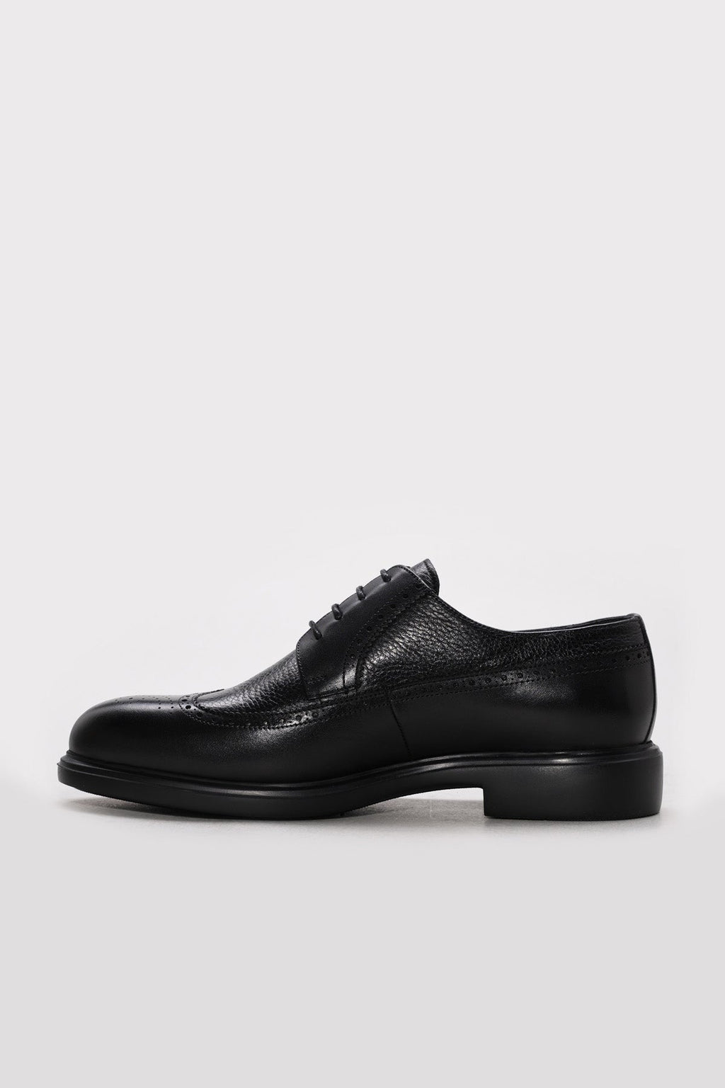 Men's black leather lace-up dress shoes with textured finish and low profile sole