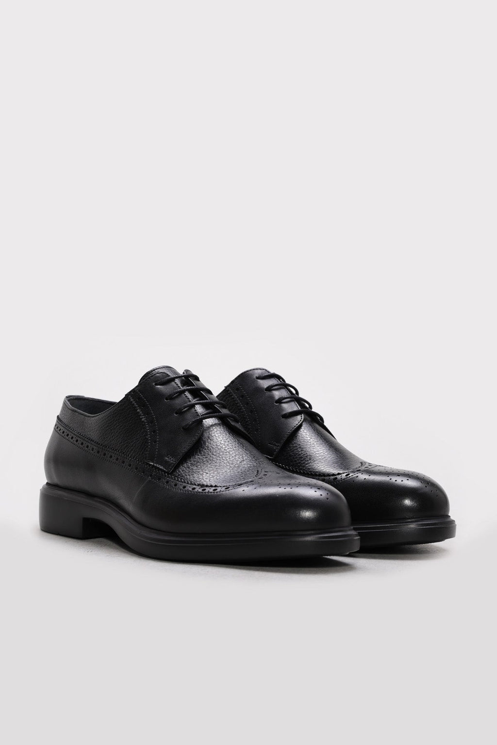 Pair of men's black leather dress shoes, lace-up with perforated toe detail
