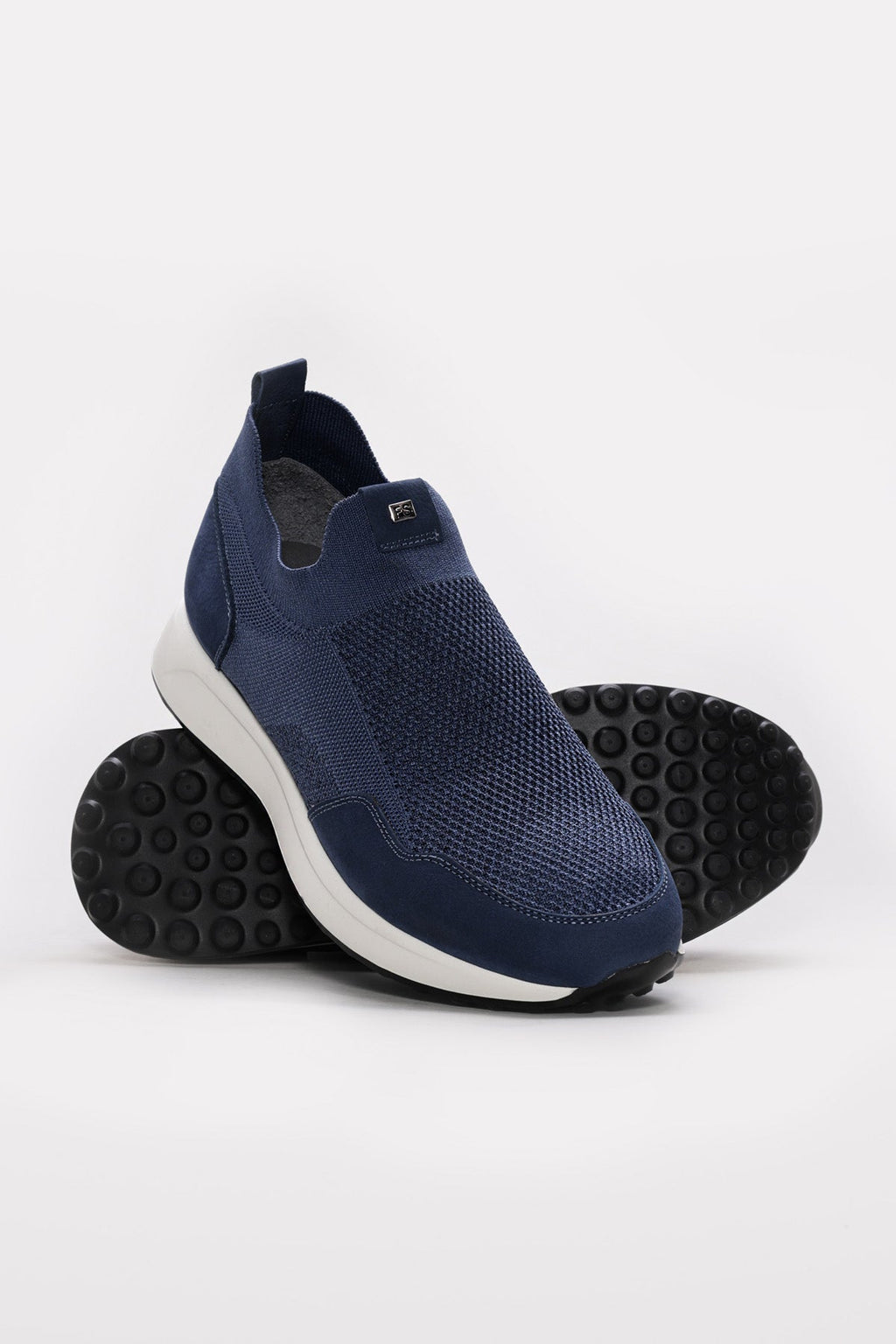 Blue slip-on sneaker with sock-like lining and side textured panel