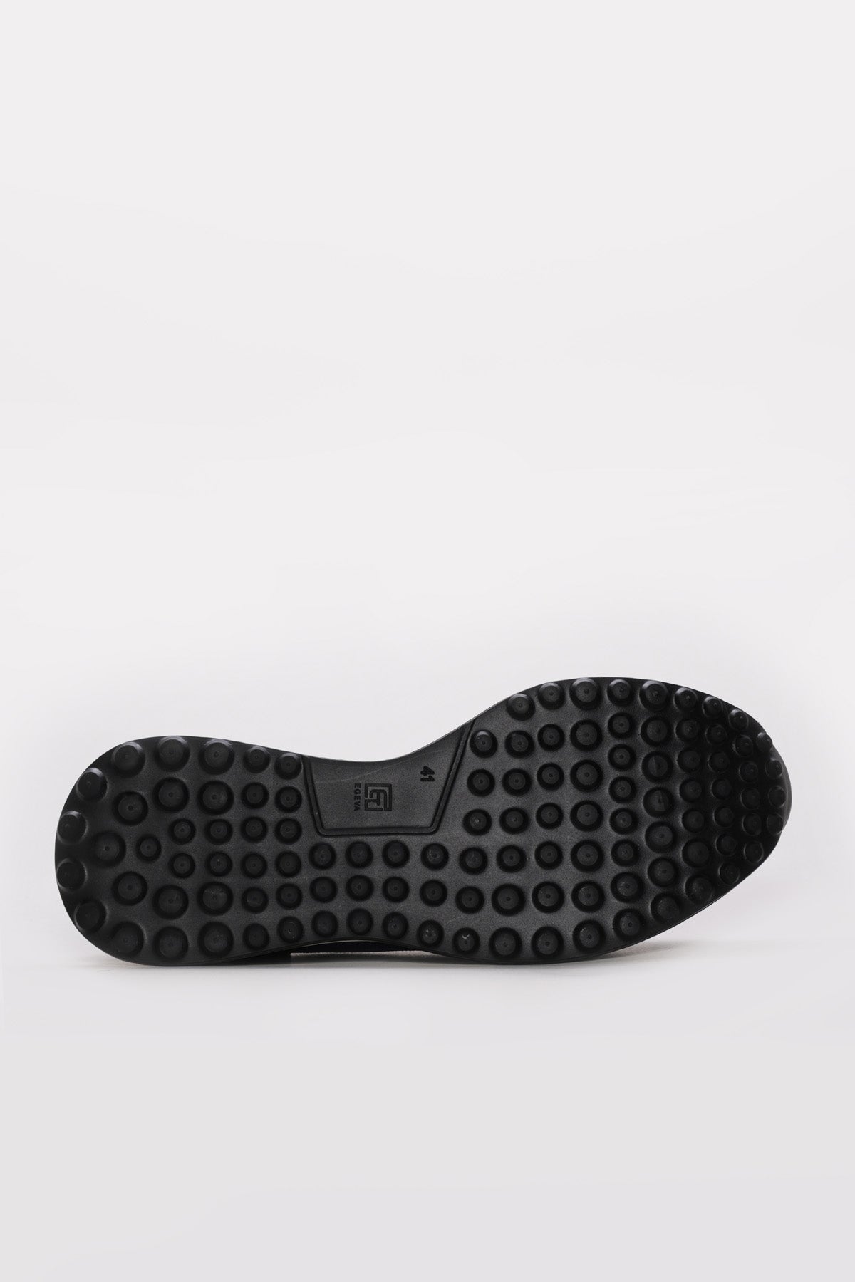 Blue slip-on sneaker outsole with black rubber tread pattern