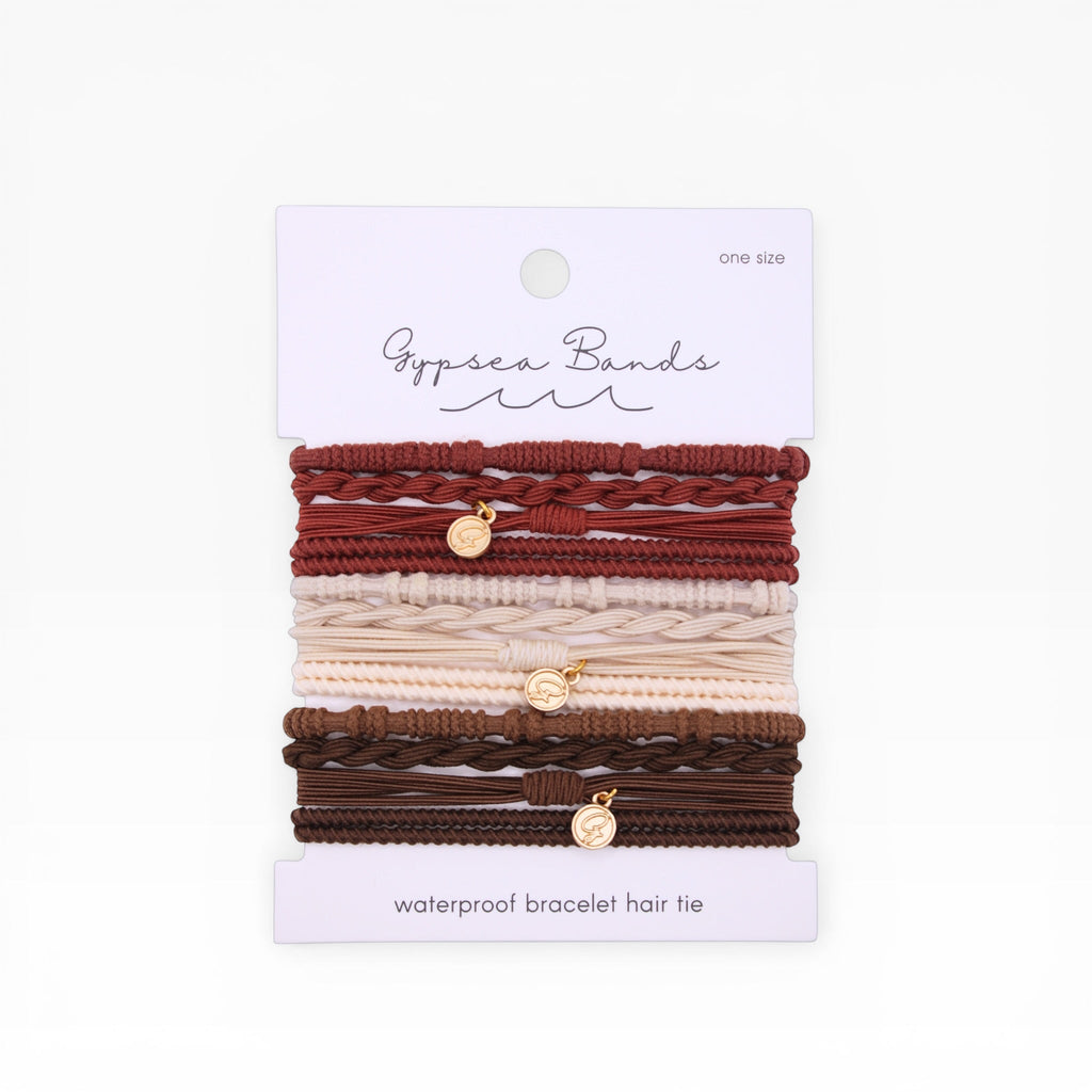 Set of braided hair tie bracelets with gold-tone charms, in red, pink, and brown