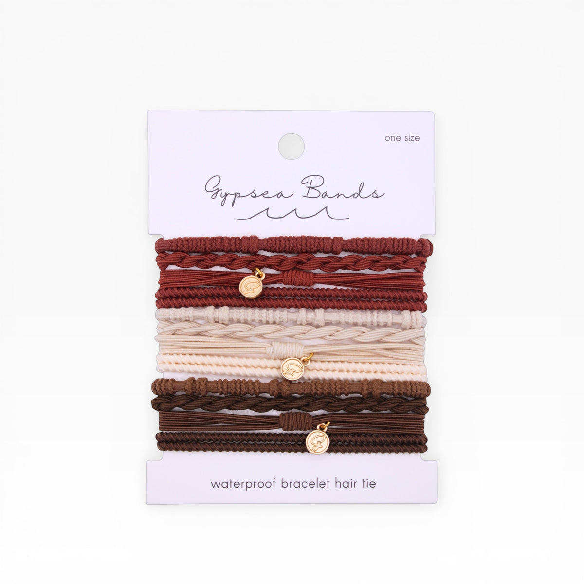 Set of braided hair tie bracelets with gold-tone charms, in red, pink, and brown