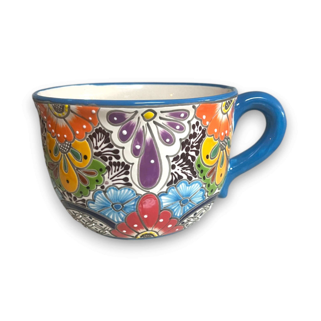 Hand-painted ceramic tea cup planter with blue handle and purple flower butterfly artwork