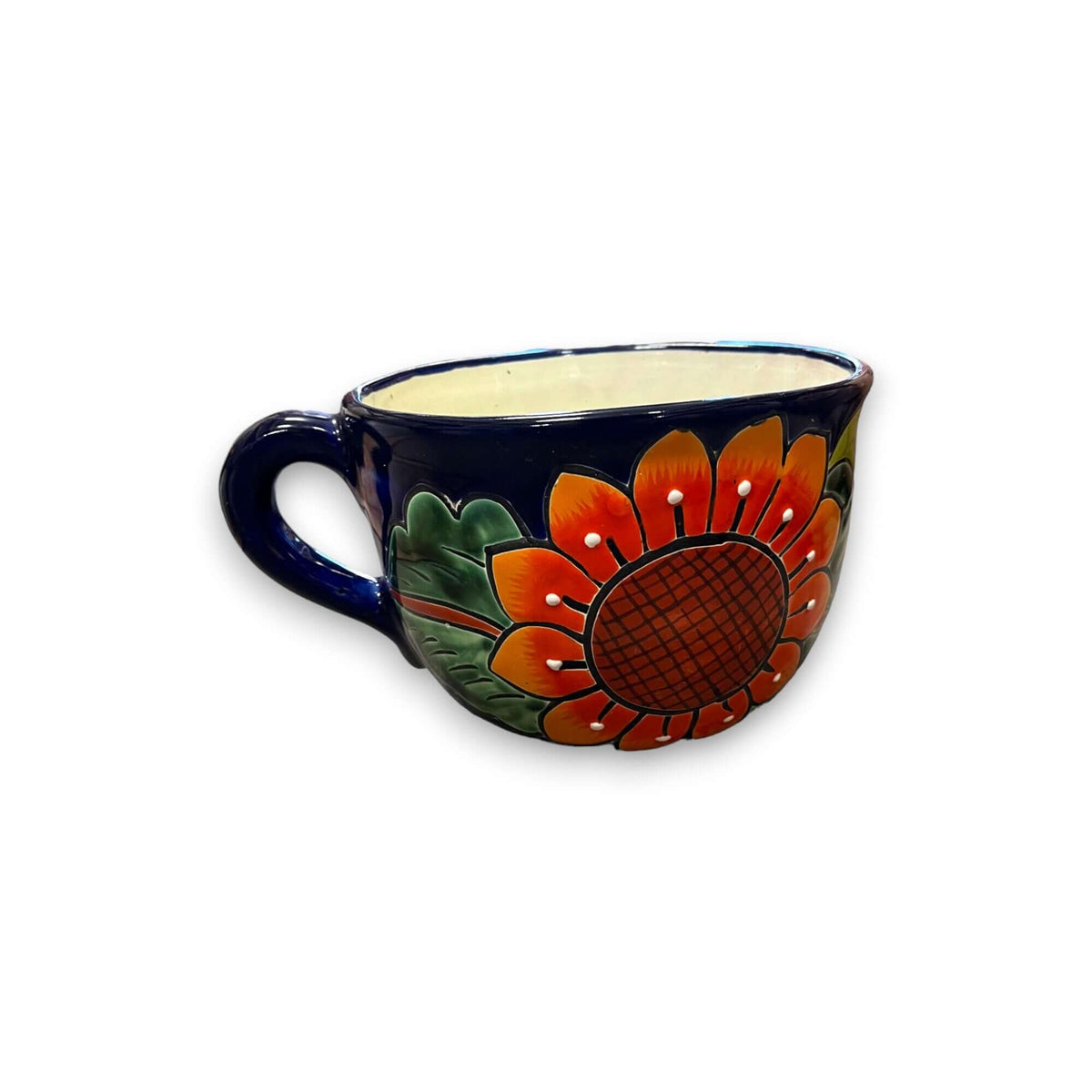 Hand-painted ceramic tea cup planter with dark blue handle and orange sunflower motif