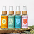 Four instant hand sanitizer bottles with clear spray caps and wood collars