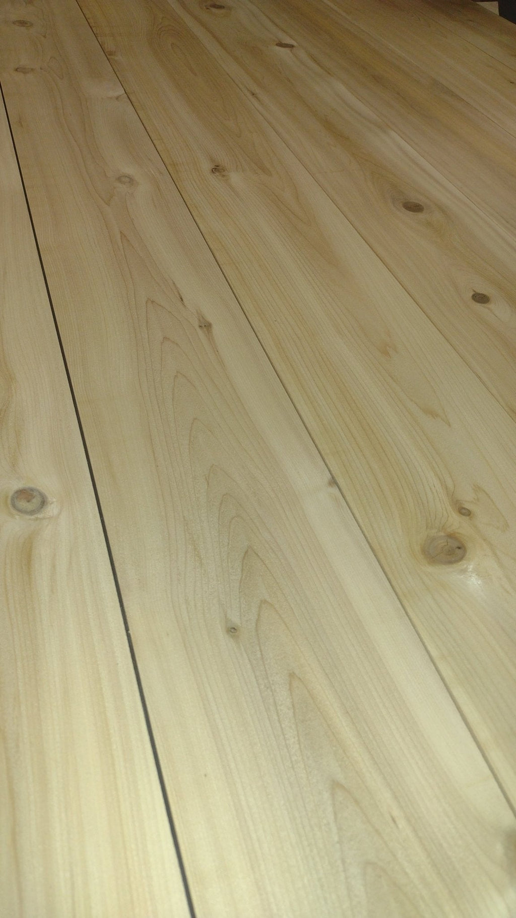 Light wood tabletop planks with visible grain and seams for outdoor picnic table