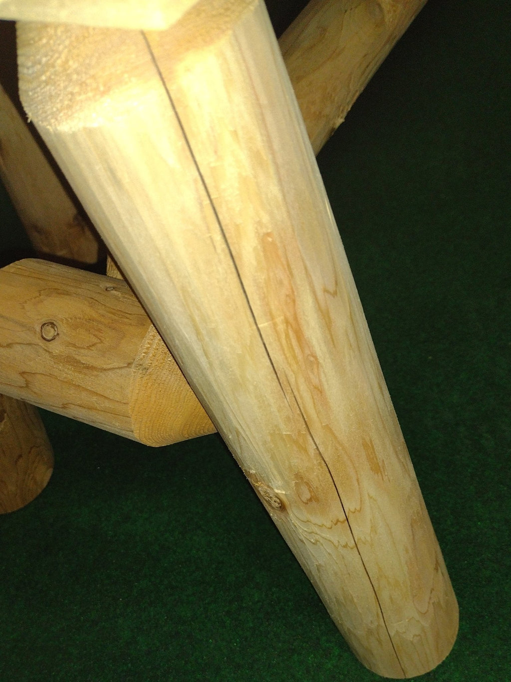 Angled wooden table leg and bench frame, smooth light wood join and grain