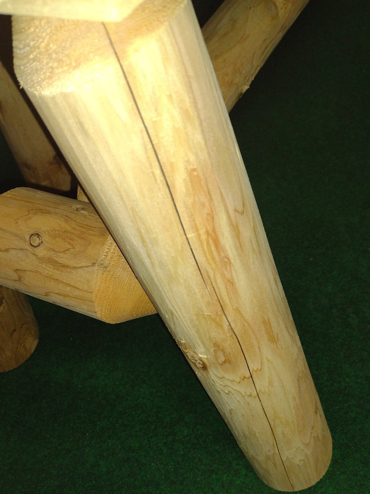 Angled wooden table leg and bench frame, smooth light wood join and grain