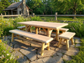 Rustic outdoor picnic table with attached bench and long tabletop, natural light wood