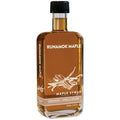 Cinnamon-vanilla maple syrup bottle with black cap, amber glass and front label