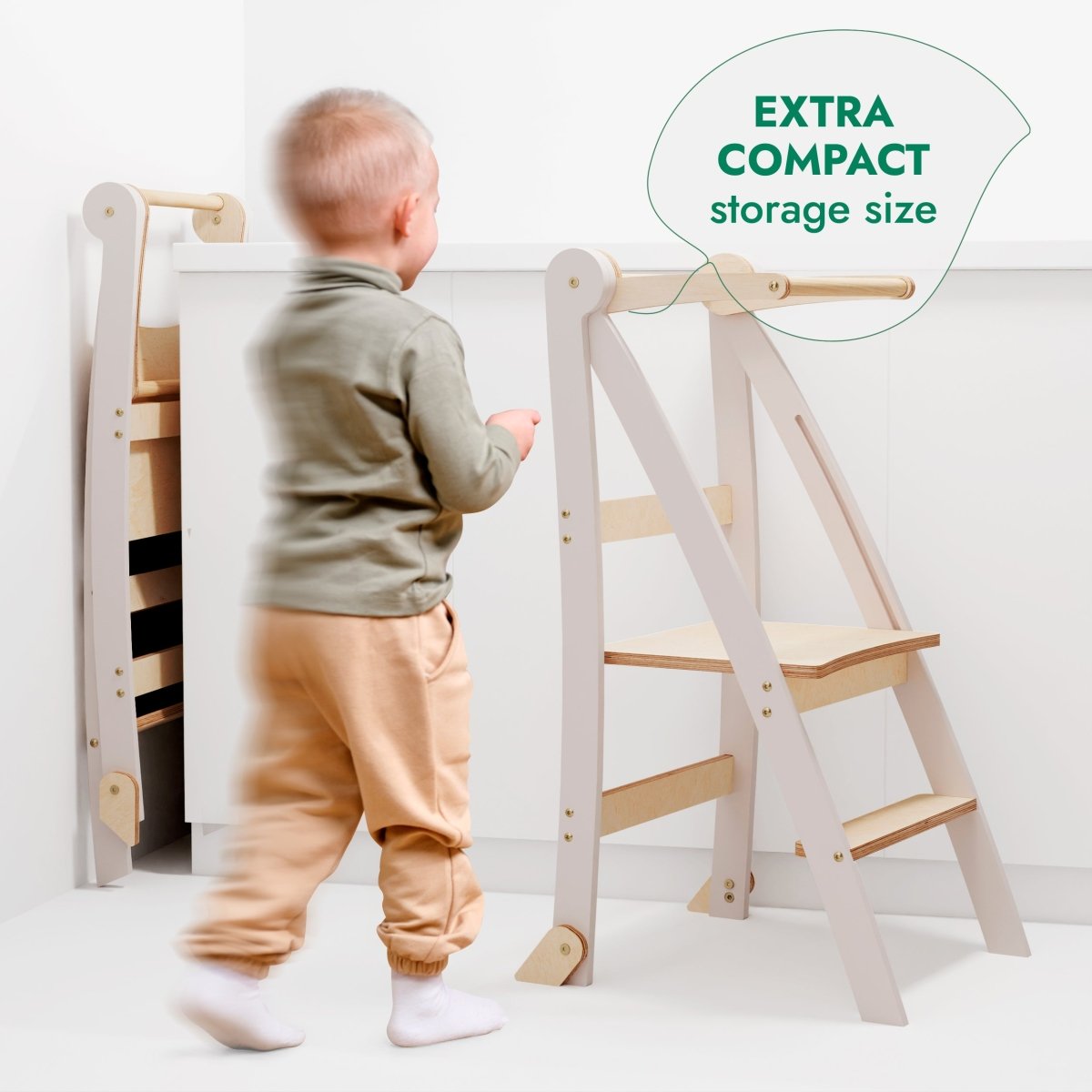 Kids compact foldable step stool with light wood steps, toddler holding the side rail