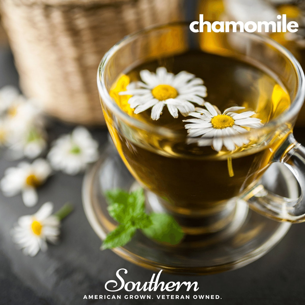 Herbal tea seed assortment with chamomile tea in glass cup and white daisies