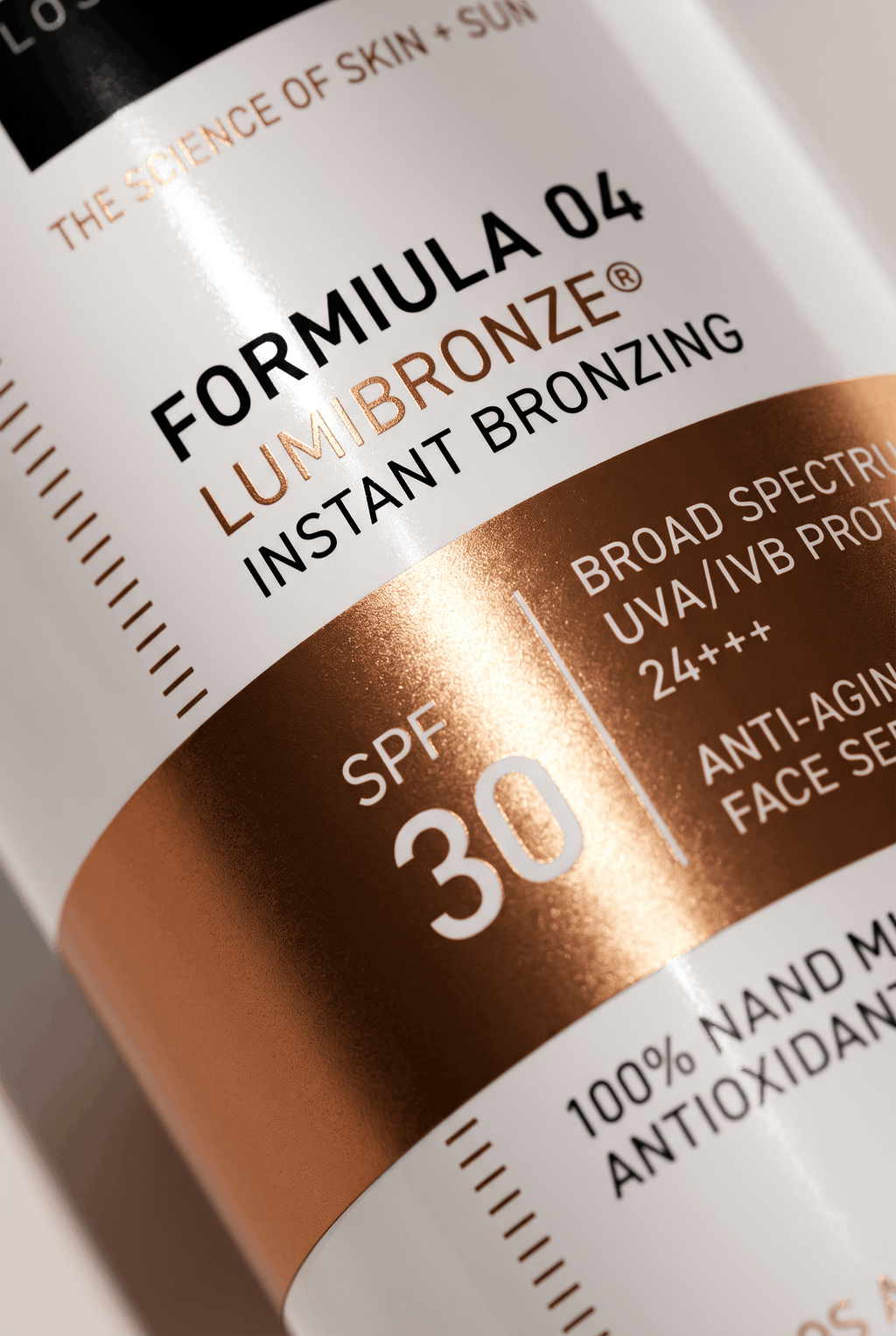 Bronzing serum label close-up showing SPF 30 and instant bronzing
