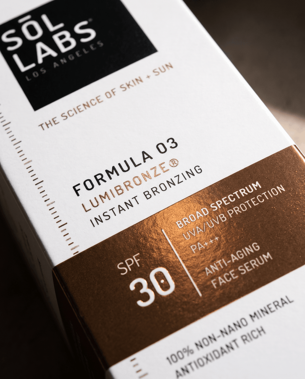 Serum box label close-up showing bronzing formula and SPF 30
