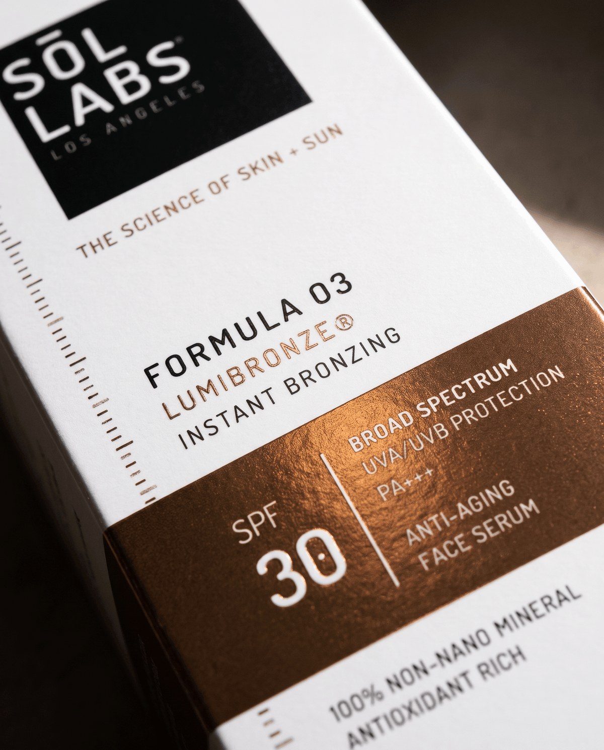 Serum box label close-up showing bronzing formula and SPF 30